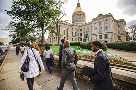 Students and faculty walking to the capital building in Atlanta