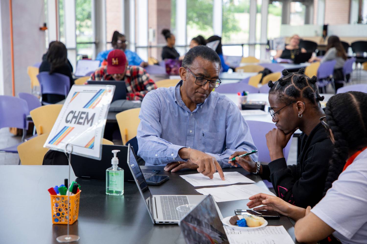 Dr. Cass Parker with students at Finals Study Jam