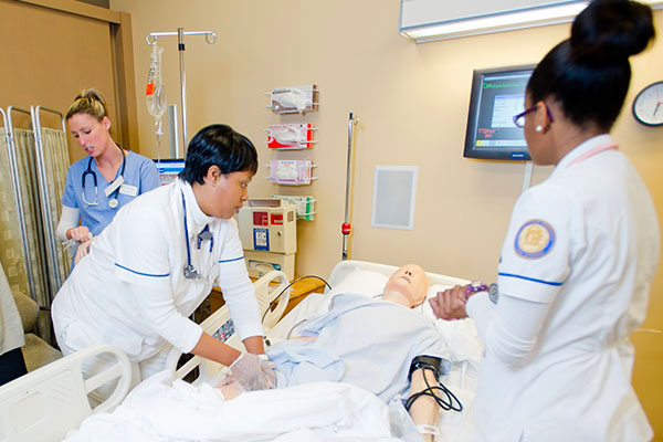 Students in sim lab taking vitals