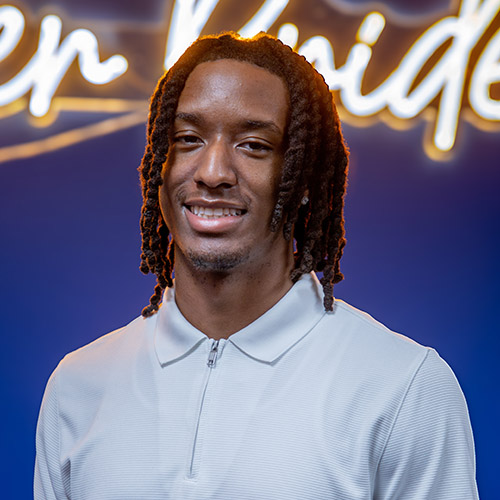 Image of Markeith Horace, wearing an off-white zip-up polo-style shirt