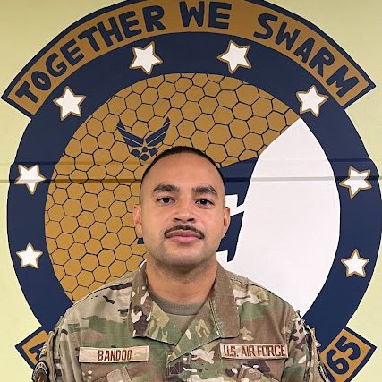 Image of Joshua Bandoo wearing his Air Force fatigues complete with his name and Air Force patches attached
