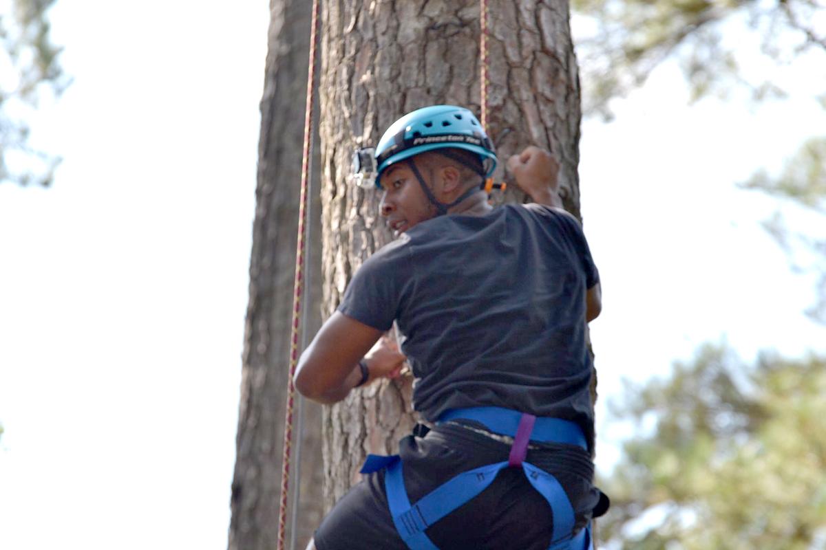 Student repelling tree