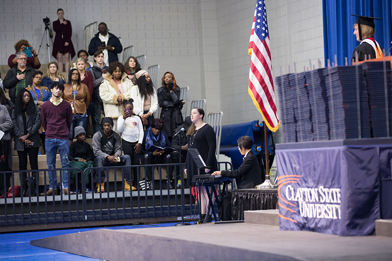 Student signing National Anthem