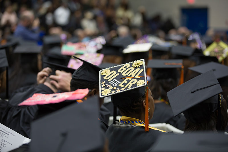 Graduate mortar board goal over