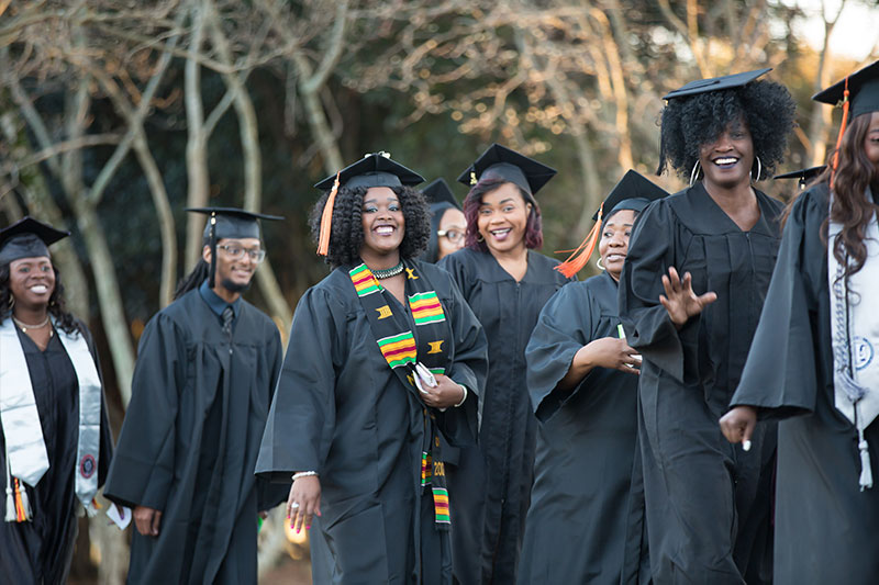 Happy graduates in a line