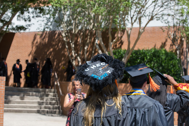 Graduates walking in commencement