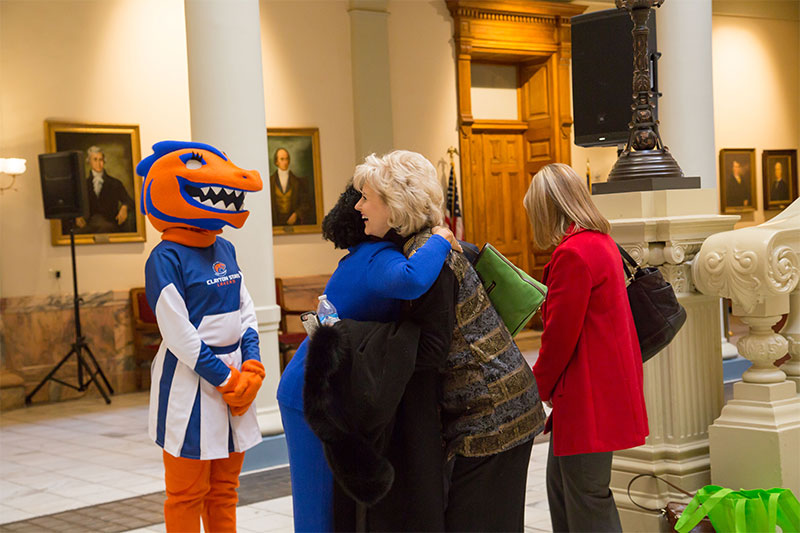 Group of Clayton State attendees with nessie