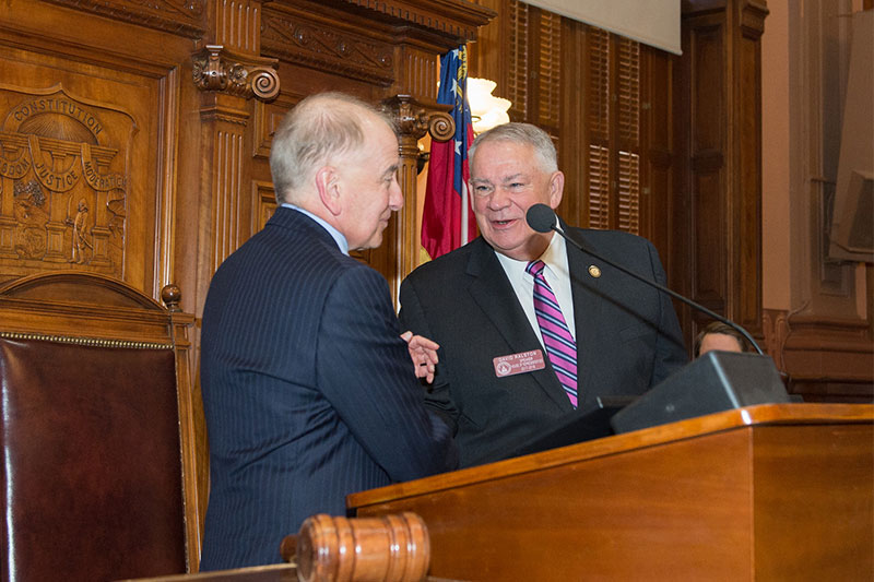 Dr. Hynes shaking hands with a congressman