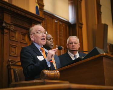 Hynes speaking at the Capitol