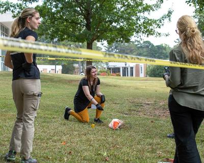 Attendee looking at an animal crime scene