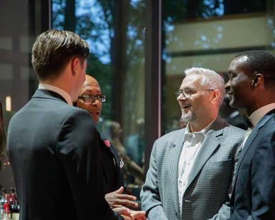 Dr. Hooks and Dr. Lewis speaking with attendees