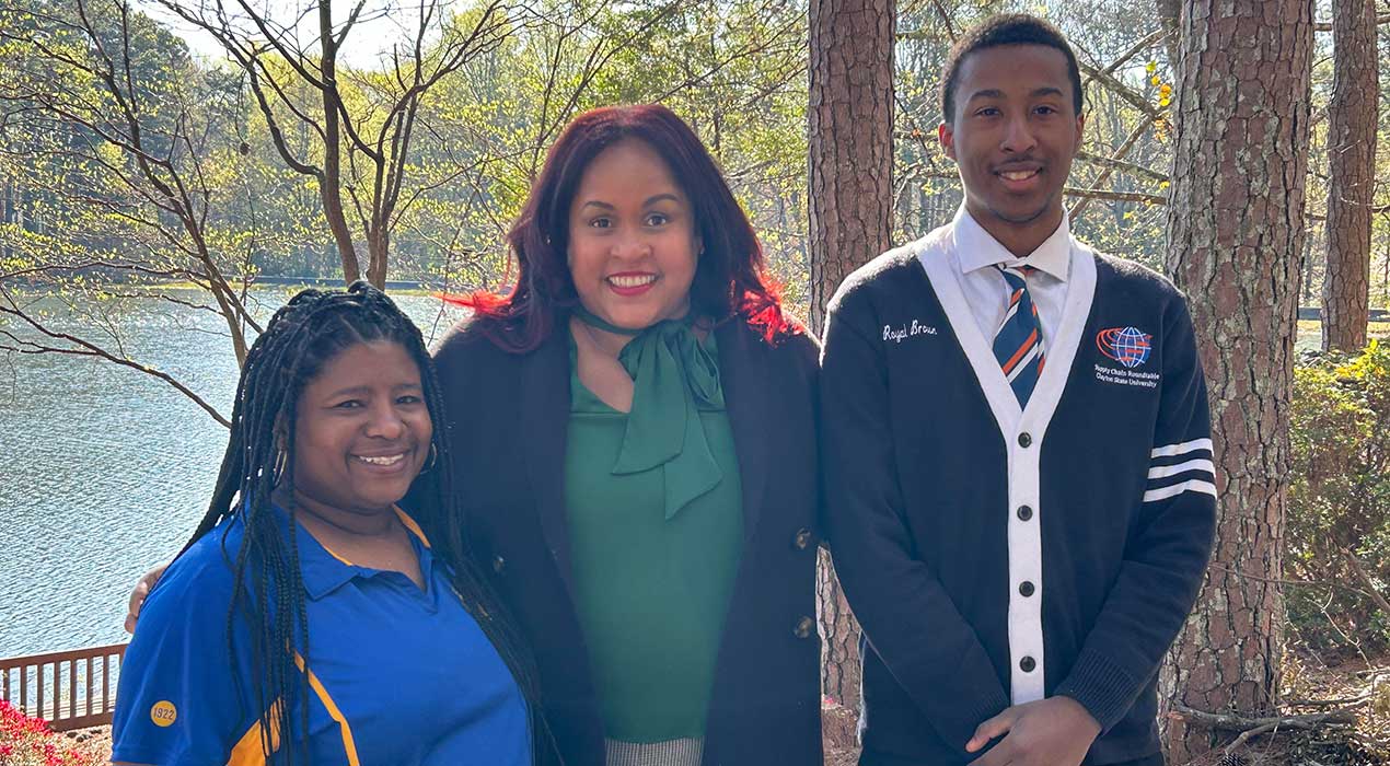 Dr. Carin Lightner-Laws stands proudly with her two student event organizers, Claribel Ross and Royal Brown