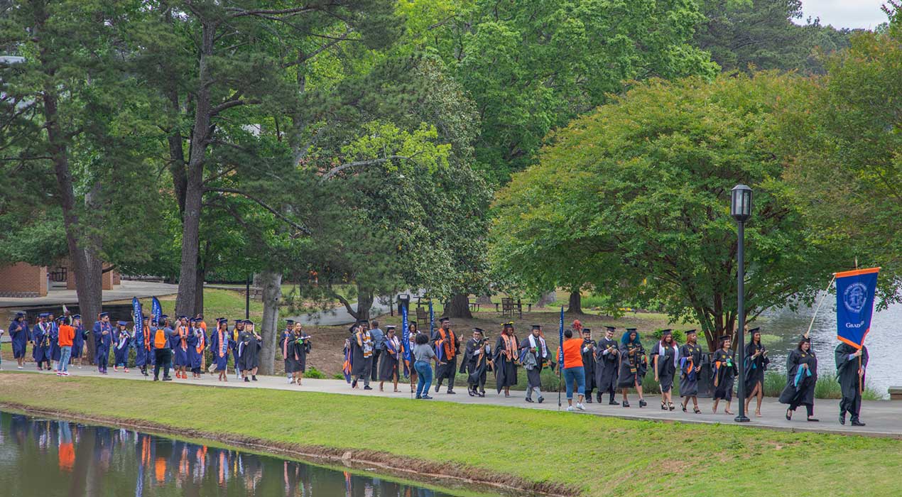 Lakers walk to their commencement ceremony at the university's Athletics Center