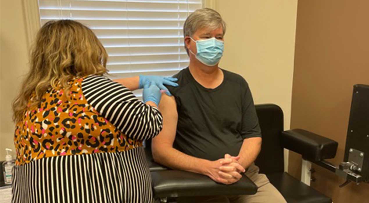 Dr. Michael Scott receiving COVID vaccine