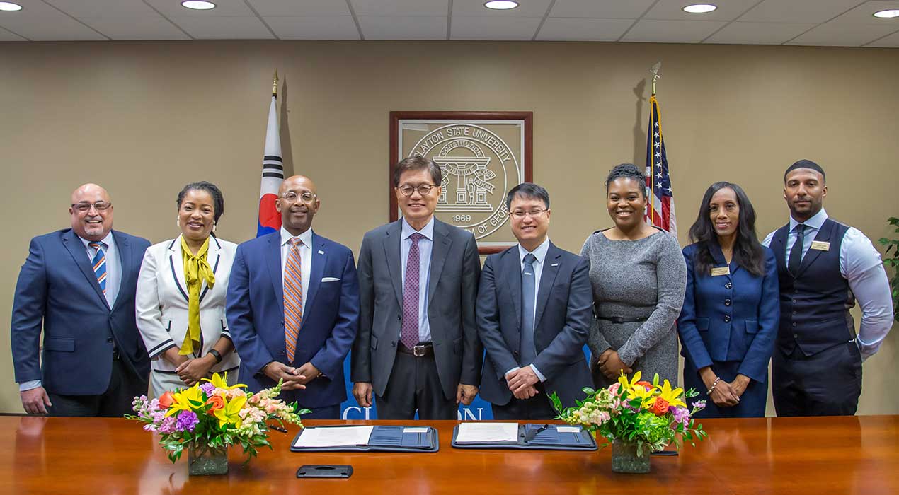 Clayton State President, Dr. Georj Lewis, and Woosong University President, Deog-Seong Oh, are joined by members of cabinet from both institutions