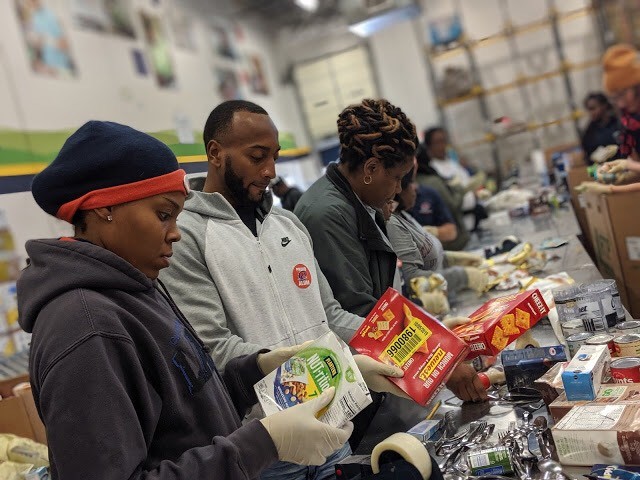 Alumni preparing food at Atlanta Community Food Bank