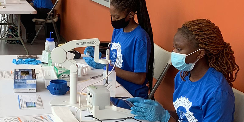 students testing water samples