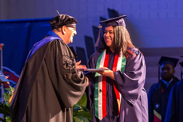 graduate receiving diploma